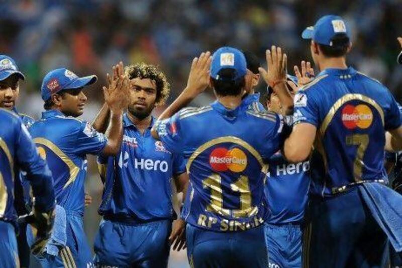 Lasith Malinga, third from left, took four wickets at Wankhede Stadium last night. Punit Paranjpe / AFP
