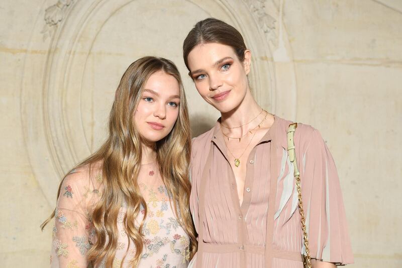 Natalia Vodianova (R) and her daughter attend the Christian Dior show (Photo by Pascal Le Segretain/Getty Images)