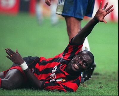 FILE - In this Wednesday, Sept 11, 1996 file photo Milan's striker George Weah cries for help after injuring his left hand during Milan vs Porto, Group D, Champions Cup match in Milan. Former international soccer star George Weah will be sworn into office Monday as Liberia's new president, taking over leadership of this post-war, impoverished West African nation from Africa's first female president. (AP Photo/Carlo Fumagalli, File)