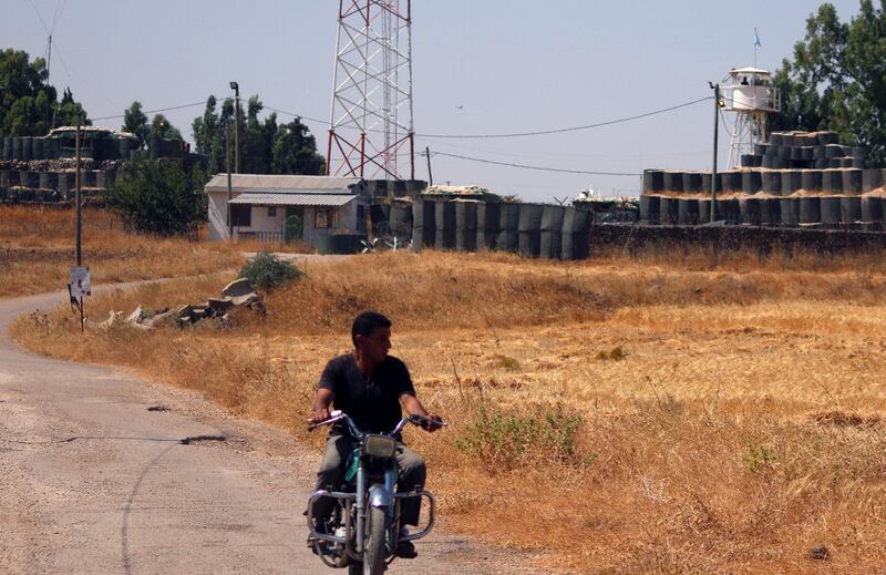 A man drives a motorcycle near the UN disengagement observer force checkpoint in Quneitra, Syria on July 10, 2017. Alaa Al Faqir / Reuters