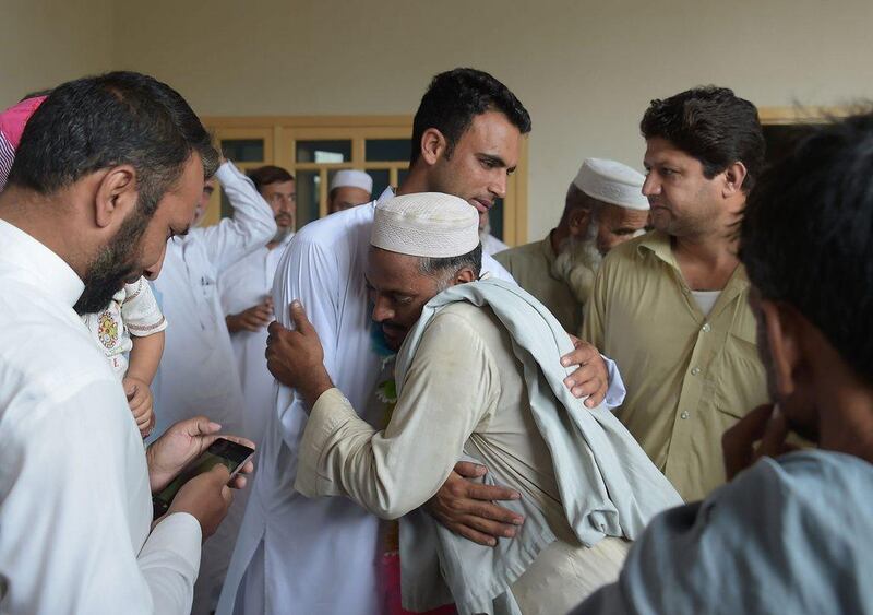 Fakhar Zaman meets with local residents and cricket fans during a visit to his village following Pakistan's triumphant Champions Trophy campaign. Aamir Qureshi / AFP

