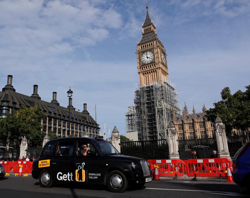 A black taxi passes the Houses of Parliament in London, Britain September 24, 2017.  REUTERS/Eddie Keogh