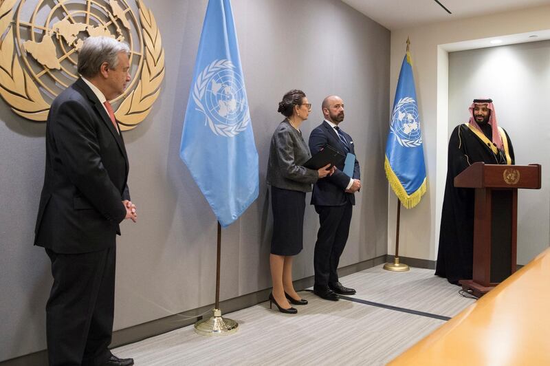 Saudi Arabia's Crown Prince Mohammed bin Salman, far right, speaks to United Nations Secretary-General Antonio Guterres, far left, during a signing ceremony at UN headquarters on Tuesday, March 27, 2018. Eskinder Debebe / United Nations via AP