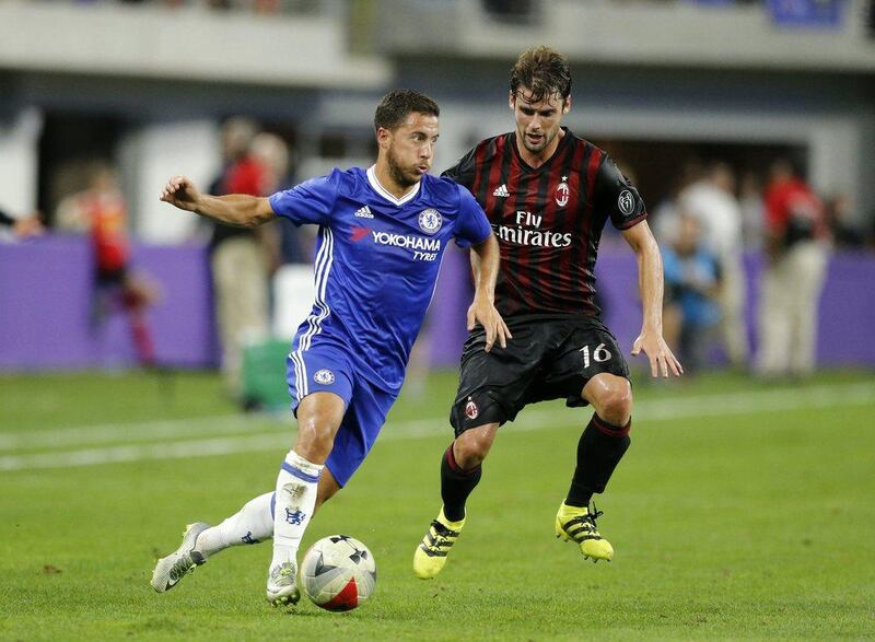Chelsea forward Eden Hazard in action with AC Milan’s Andrea Poli. Eric Miller / Reuters
