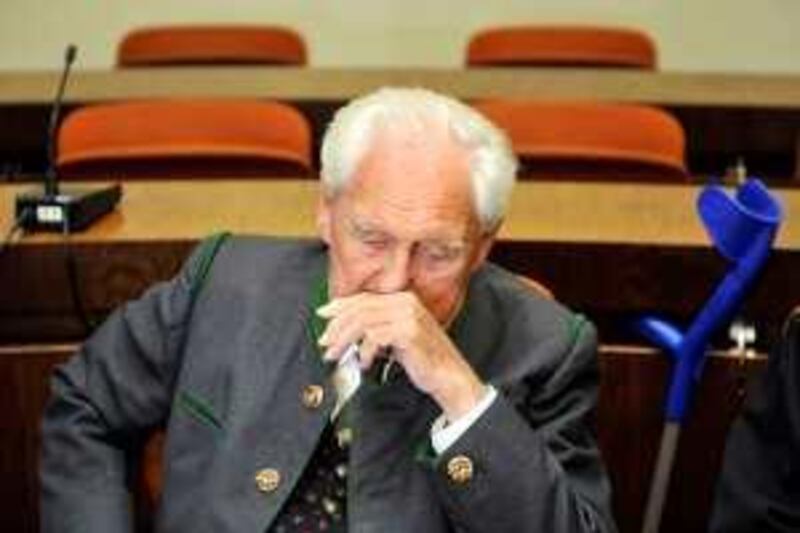 Former commander of a German mountain infantry battalion Josef Scheungraber sits in the regional court in the southern German city of Munich on August 11, 2009 during the announcement of his verdict. The court jailed Scheungraber for life today for ordering the killing of 14 Italian civilians in the Tuscan village of Falzano near Cortona on June 26, 1944 in one of Germany's last major Nazi war crime trials. The 90-year-old German has already been sentenced in absentia by an Italian military court to life in prison for a Nazi war crime. Scheungraber has lived for decades as a free man in Ottobrunn outside Munich, where he has served on the town council and run a furniture shop. Scheungraber will receive his verdict on on August 11, 2009.   AFP PHOTO/ DDP/ JOERG KOCH   --GERMANY OUT-- *** Local Caption ***  572057-01-08.jpg