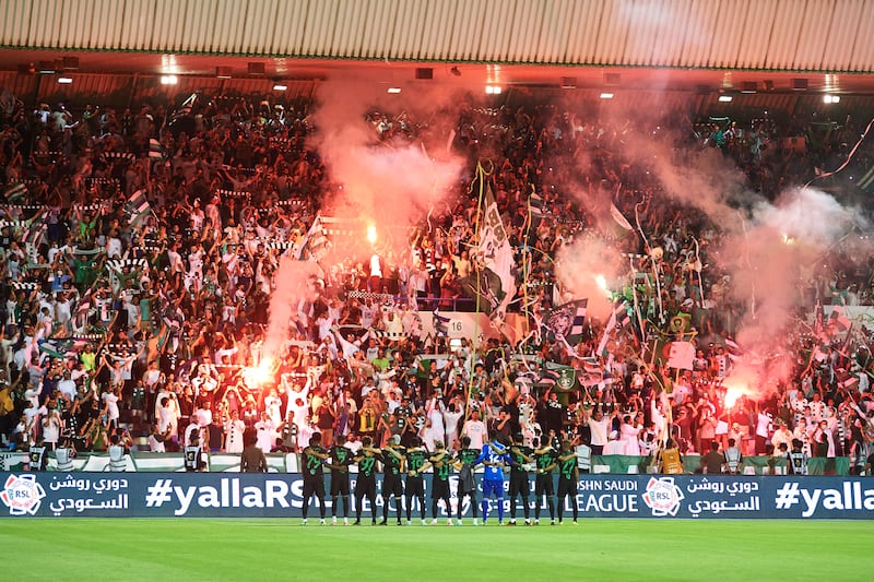 Al Ahli players celebrate with the fans inside Prince Mohamed bin Fahd Stadium. Getty