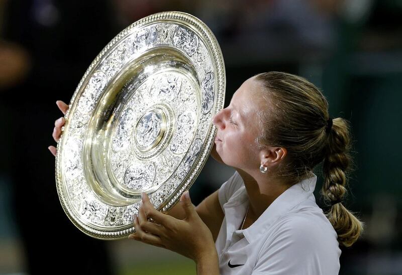 Petra Kvitova holds the Venus Rosewater Dish after her victory in the 2014 Wimbledon women's singles final on Saturday at the All England Club in London, England. Suzanne Plunkett / Reuters