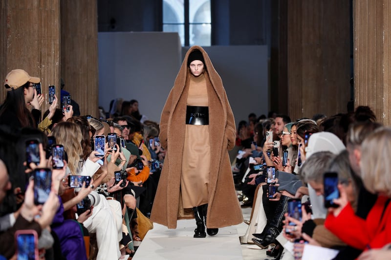 The Max Mara show opened with the famous teddy coat rethought as a hooded cape. Reuters 
