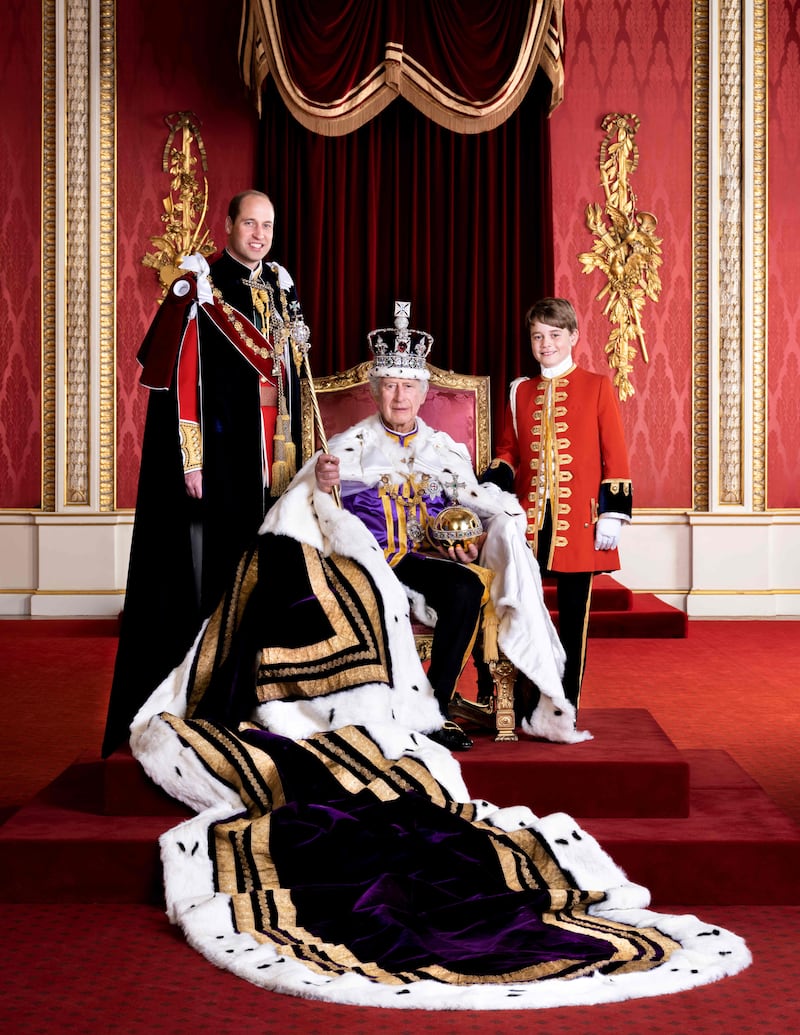A handout picture released by Buckingham Palace on May 12, 2023 shows Britain's King Charles III (C), Britain's Prince William (L), Prince of Wales, and Britain's Prince George of Wales (R), posing in the Throne Room of Buckingham Palace in London.  The King is pictured in full regalia and is wearing The Robe of Estate, the Imperial State Crown and is holding the Sovereign's Orb and Sovereign's Sceptre with Cross.  He is seated on one of a pair of 1902 throne chairs that were made for the future King George V and Queen Mary for use at the Coronation of King Edward VII.  These throne chairs were also used in the background of the 1937 Coronation of King George VI and Queen Elizabeth and King Charles III and Queen Camilla at Westminster Hall to receive addresses from the Speakers of both Houses of Parliament last year.  (Photo by Hugo BURNAND / BUCKINGHAM PALACE / AFP) / RESTRICTED TO EDITORIAL USE - MANDATORY CREDIT "AFP PHOTO / BUCKINGHAM PALACE / HUGO BURNAND / ROYAL HOUSEHOLD 2023  " - NO MARKETING NO ADVERTISING CAMPAIGNS - DISTRIBUTED AS A SERVICE TO CLIENTS - NO DIGITAL MANIPULATION 
This photograph can not be used after 2259hrs GMT on December 31, 2023, without prior, written permission from Royal Communications.  After that date, no further licensing can be made.  The portrait should be used in the context of Their Majesties' Coronation.  Any questions relating to the use of the photographs should be first referred to Buckingham Palace before publication. The photograph is provided to you strictly on condition that you will make no charge for the supply, release or publication of it and that these conditions and restrictions will apply (and that you will pass these on) to any organisation to whom you supply it.  There shall be no commercial use whatsoever of the photograph (including by way of example ) any use in merchandising, advertising or any other non-news editorial use.  The photograph must not be digitally enhanced, manipulated or modified in any manner or form