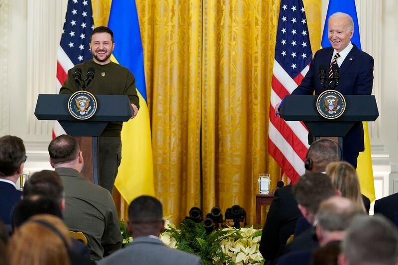 Mr Zelenskyy and US President Joe Biden share a light-hearted moment during their briefing at the White House. AP