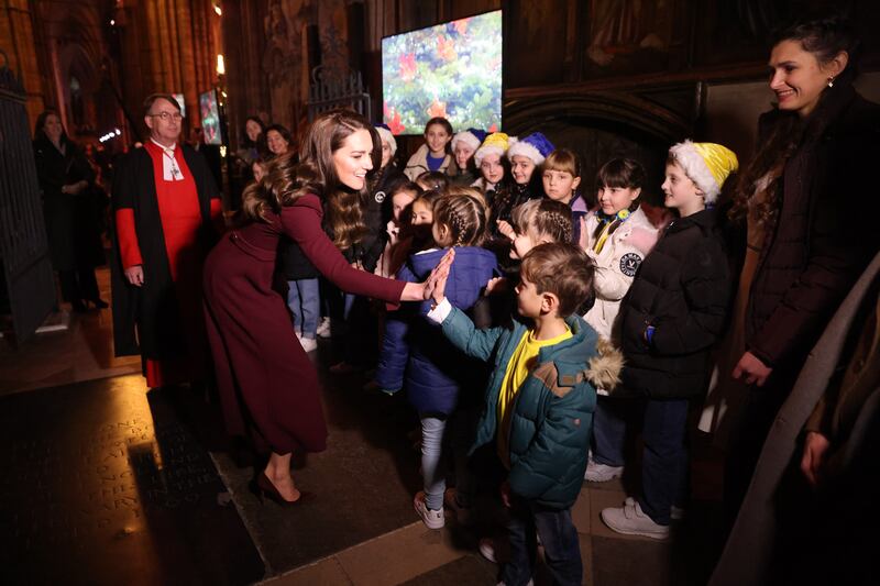 The Princess of Wales greets children with a high five. Getty Images