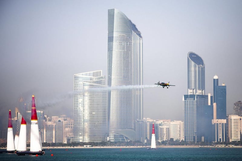 Qualifying for the Red Bull Air Race took place at Abu Dhabi's Corniche on Friday, much to the enjoyment of the thousands gathered in the area. In the air here is a pilot in the Challenger Race class. Lee Hoagland / The National 
