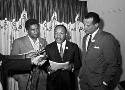 Martin Luther King Jr, centre, and Belafonte at a press conference in Atlanta on April 30, 1965. AP