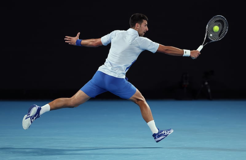 Novak Djokovic reaches for a backhand during his Australian Open fourth-round match. Getty Images