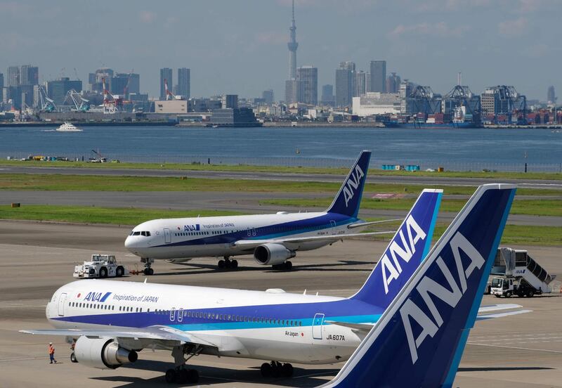 (FILES) In this file photo taken on July 31, 2018, Boeing passenger planes of All Nippon Airways are seen at Tokyo's Haneda airport.  The operator of Japan's All Nippon Airways said on January 29, 2019 it has decided to order a total of 48 aircraft from Boeing and Airbus for deliveries from 2021 through 2025.  / AFP / Kazuhiro NOGI
