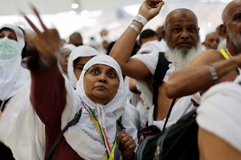 Pilgrims cast their stones. Reuters