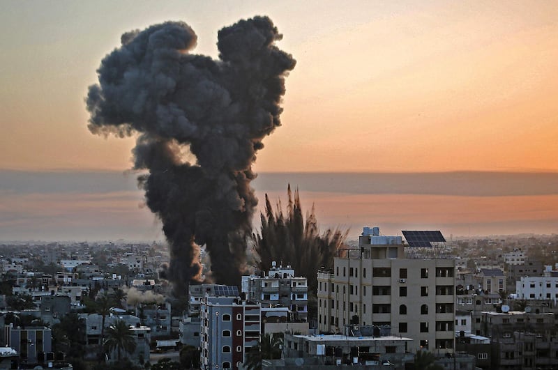 A plume of black smoke rises into the air in Khan Yunis, in the southern Gaza Strip, following an Israeli air strike on the area, which is controlled by the militant Hamas movement. AFP