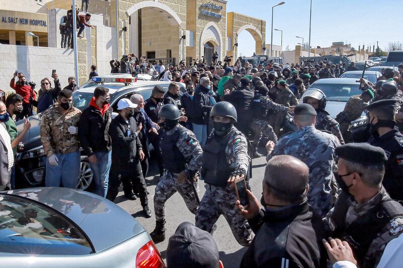 Members of Jordan's Darak forces keep demonstrators away outside al-Hussain New Salt Hospital in the town of Salt. AFP