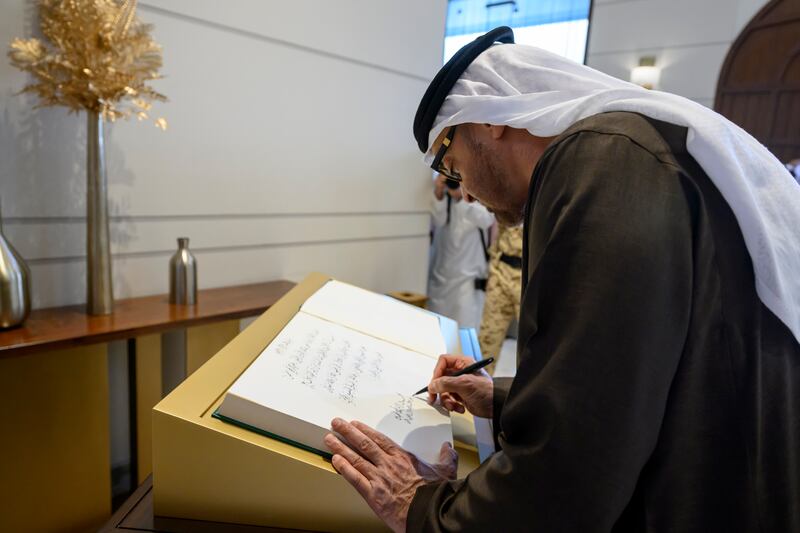 Sheikh Mohamed signs a guest book at Bahrain National Guard Headquarters. Hamad Al Kaabi / UAE Presidential Court 