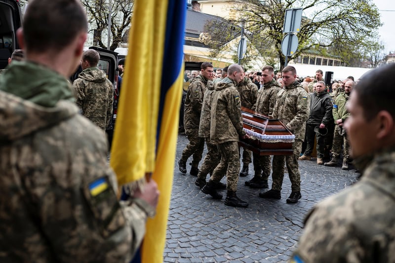Colleagues bid farewell to Yuriy Dadak-Ruf and Taras Kryt, the Ukrainian soldiers killed in Russian shelling of the Luhansk region. Reuters