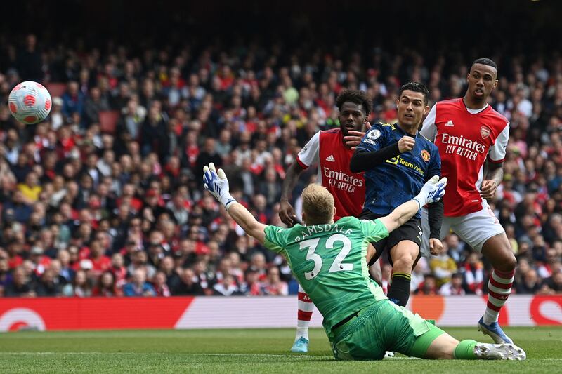 Manchester United's Cristiano Ronaldo scores in the Premier League match againstr Arsenal at the Emirates Stadium in April, 2022. AFP