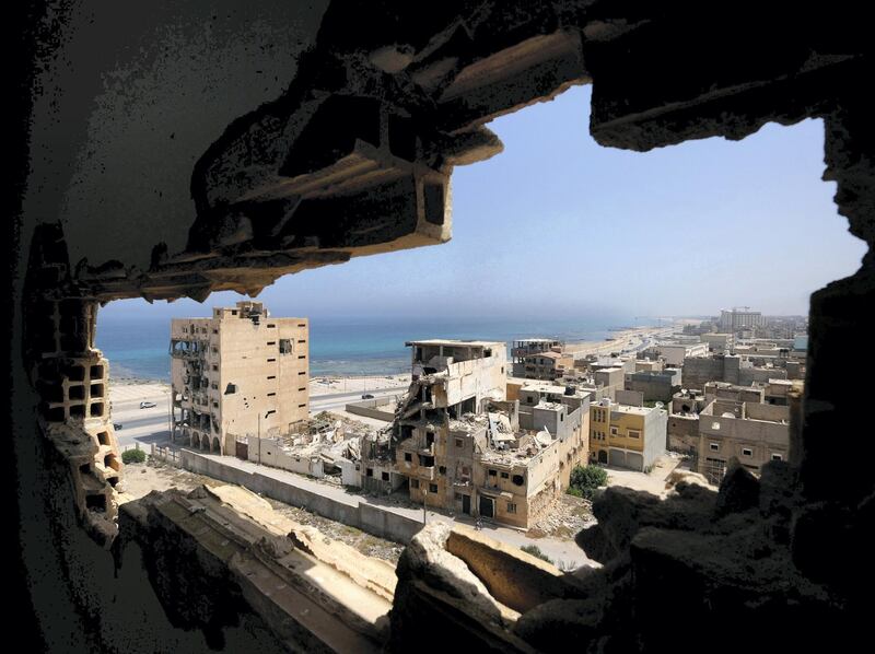 Destroyed buildings are seen through a hole in Benghazi lighthouse after it was severely damaged by years of armed conflict, in Benghazi, Libya July 10, 2019 . Picture taken July 10, 2019.  REUTERS/Esam Omran Al-Fetori     TPX IMAGES OF THE DAY