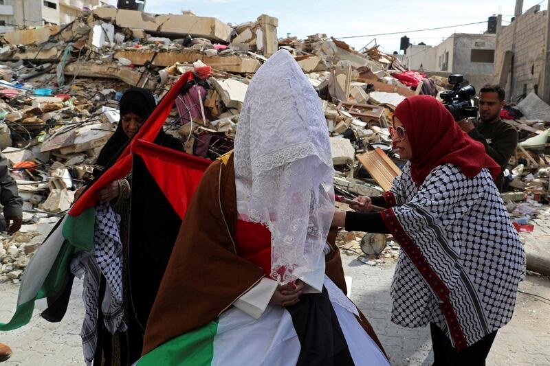 Palestinian bride Shayma Al-Huwaity, 20, is seen near her family house that was damaged recently in an Israeli air strike on a nearby Hamas site, on her wedding day in Gaza City. REUTERS