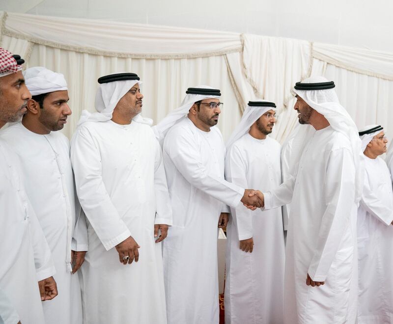 SHAWAMEKH, ABU DHABI, UNITED ARAB EMIRATES - September 15, 2019: HH Sheikh Mohamed bin Zayed Al Nahyan, Crown Prince of Abu Dhabi and Deputy Supreme Commander of the UAE Armed Forces (R), offers condolences for martyr Warrant Officer Zayed Musllam Suhail Al Amri.

( Mohamed Al Hammadi / Ministry of Presidential Affairs )
---
