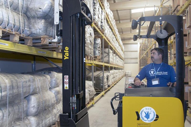 Ali Goahr, a forklift operator for the United Nations World Food Programme, moves blankets in the World Food Programme Warehouse in International Humanitarian City, Dubai.

Kevin Larkin for The National