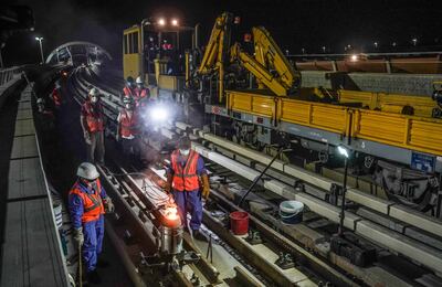 Maintenance workers inspecting train tracks. Courtesy: RTA