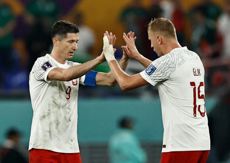 Poland's Kamil Glik with Robert Lewandowski after the match. Reuters