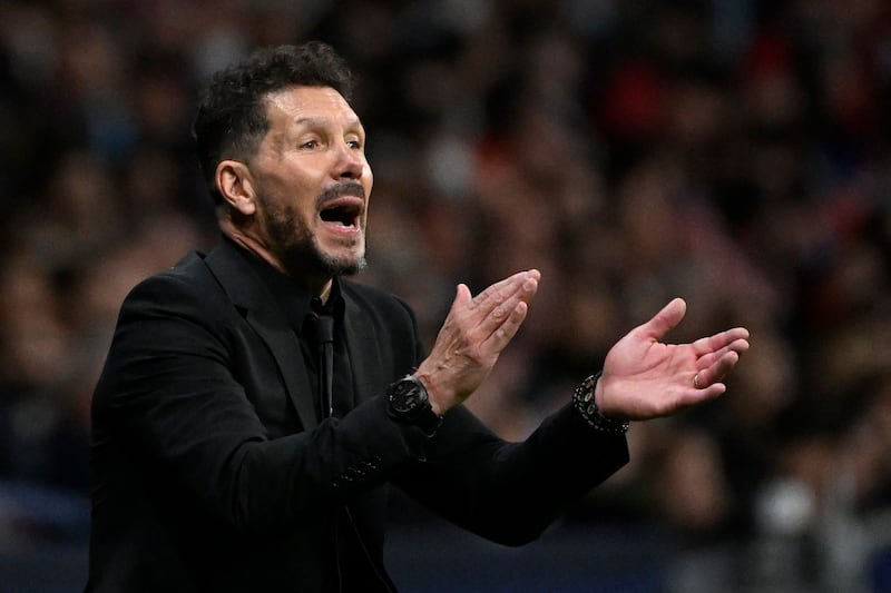 Atletico Madrid coach Diego Simeone claps. AFP