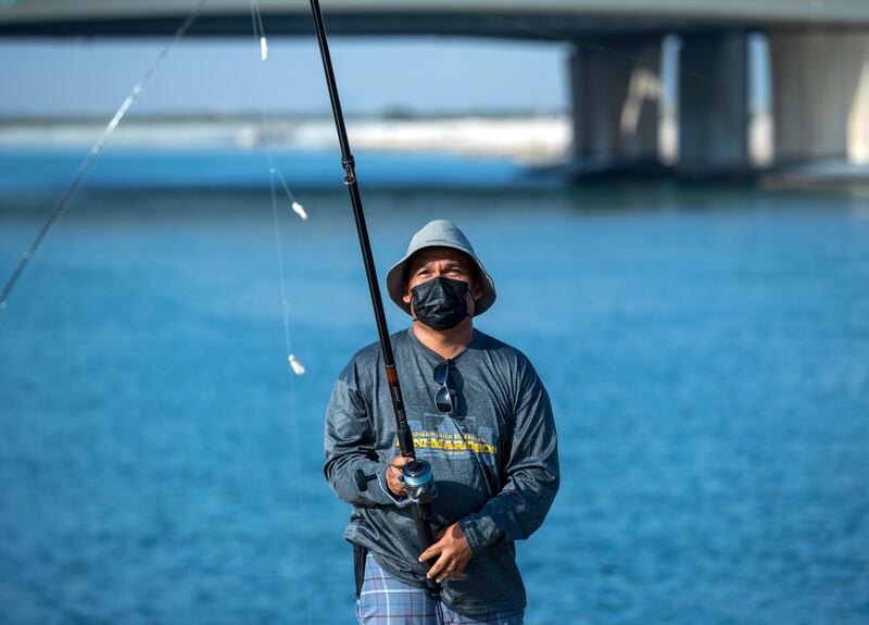 An angler casts his line at Yas Island's Iron Bridge area.