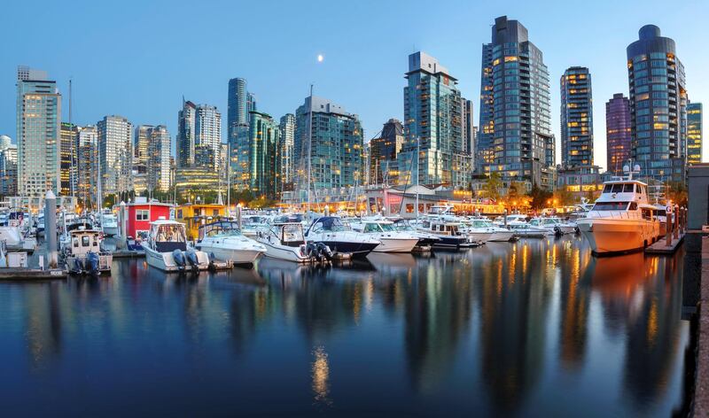 Evening views of city skyline from harbor. Vancouver. British Columbia. Canada. (Photo by: Education Images/Universal Images Group via Getty Images)