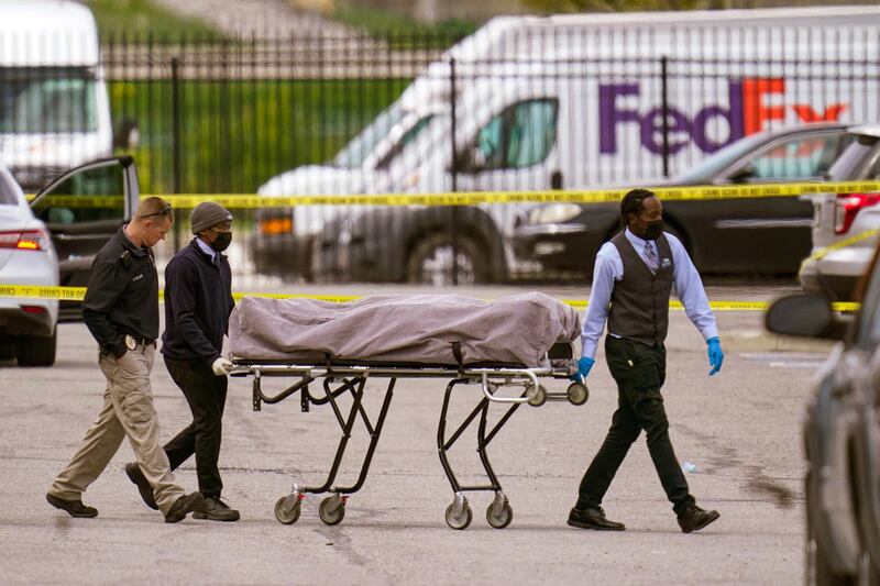 A body is taken from the scene where multiple people were shot at a FedEx Ground facility in Indianapolis. A gunman killed several people and wounded others before taking his own life in a late-night attack at a FedEx facility near the Indianapolis airport, police said.  AP Photo