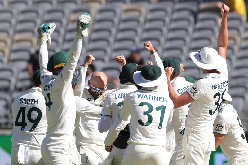 Nathan Lyon of Australia is congratulated by teammates after dismissing Faheem Ashraf of Pakistan for his 500th Test Match wicket on Day 4 of the first Test at Optus Stadium in Perth on December 17, 2023. EPA 