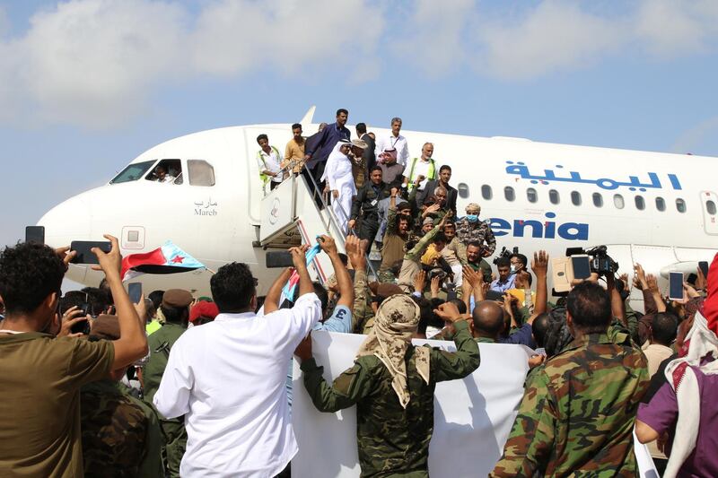 People wait to greet members a newly formed cabinet for government-held parts of Yemen upon their arrival at Aden airport, before an attack on the airport, in Aden, Yemen.  REUTERS