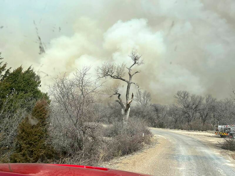 Smoke from a fire in the Texas panhandle billows over a road. AP