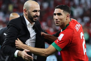 Head coach of Morocco Walid Regragui celebrates with Achraf Hakimi after the FIFA World Cup 2022 round of 16 soccer match between Morocco and Spain at Education City Stadium in Doha, Qatar, 06 December 2022.   EPA / Mohamed Messara