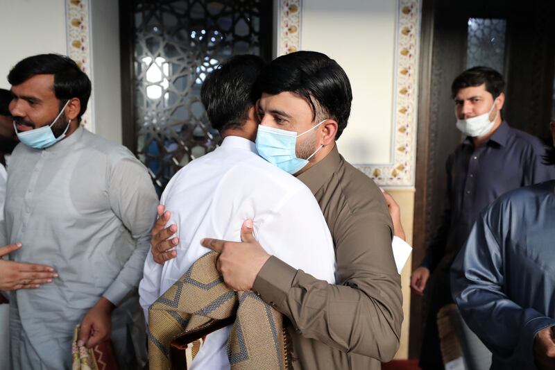 People greet each other after prayers. Chris Whiteoak / The National