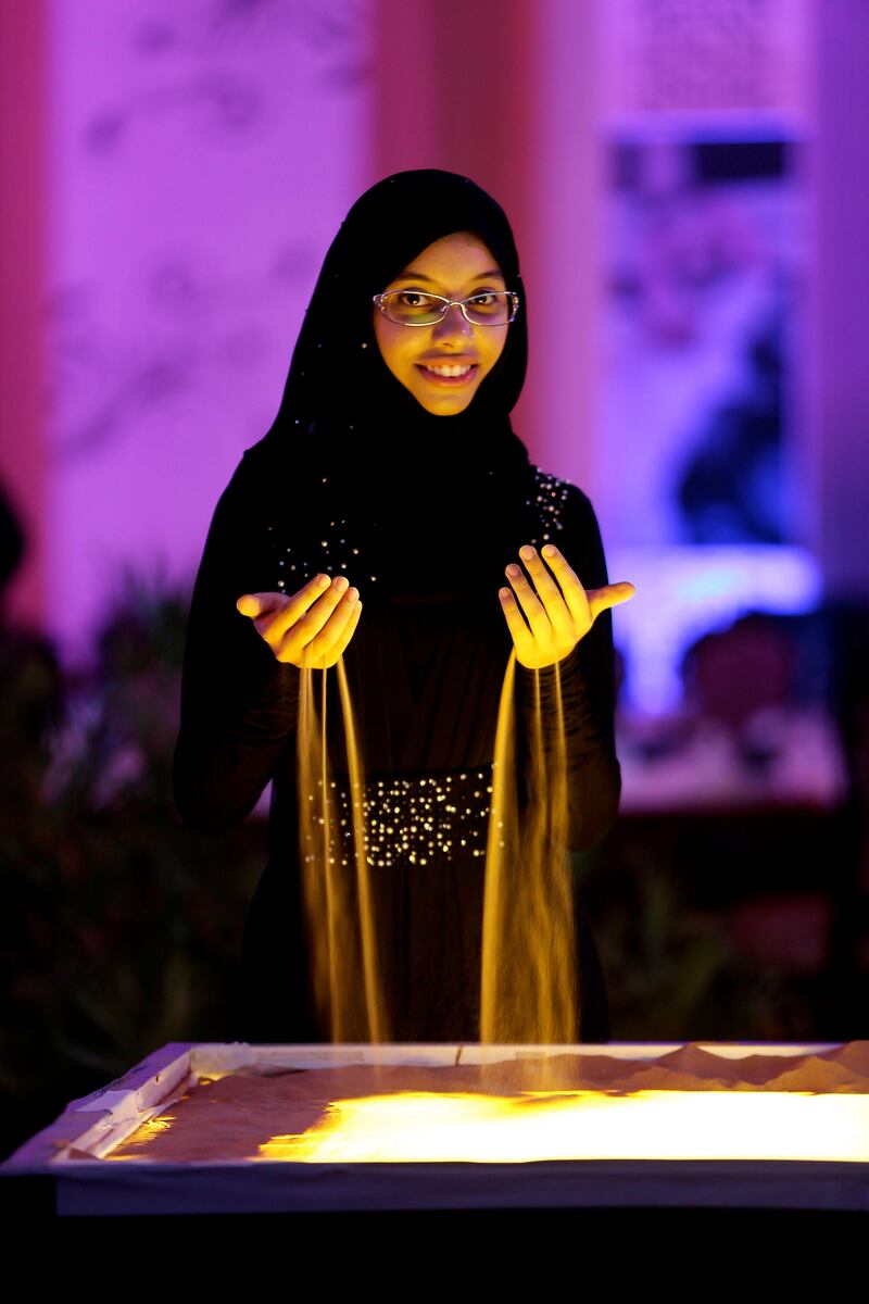 ABU DHABI , UNITED ARAB EMIRATES : July 30 , 2013 :- Shayma Al Maghairy from Oman before the start of her sand art performance at the Ramadan tent in the Emirates Centre for Strategic Studies and Research office in Abu Dhabi.  ( Pawan Singh / The National ) . For Arts & Life. Story by Anna Seaman
