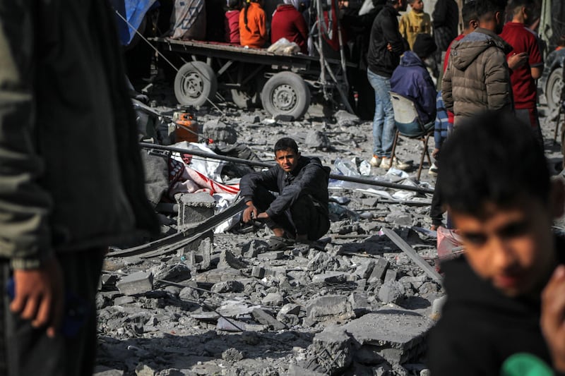 Displaced Palestinians in the ruins caused by an Israeli strike in Deir Al Balah, Gaza. Bloomberg