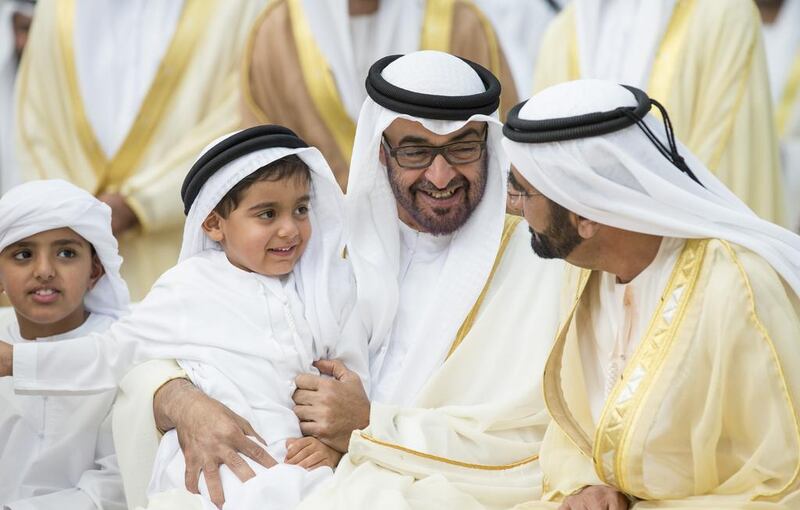 Sheikh Mohammed bin Rashid, Vice President and Ruler of Dubai, with Sheikh Mohammed bin Zayed, Crown Prince of Abu Dhabi and Deputy Supreme Commander of the Armed Forces, at a wedding for Al Nahyan and Al Qasimi family members. With them are Sheikh Tahnoon bin Mohammed bin Tahnoon Al Nahyan, on Sheikh Mohammed’s knee, and Sheikh Zayed bin Mohammed bin Hamad Al Nahyan at Mushrif Palace. Ryan Carter / Crown Prince Court – Abu Dhabi