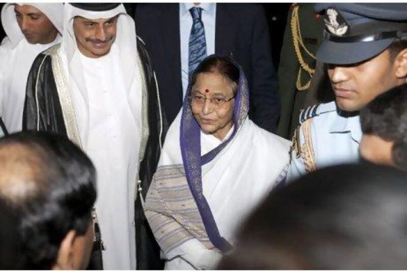 Pratibha Patil and Dr Tayeb Kamali, left, the vice chancellor of Higher College of Technology, arrive at Dubai Men's College.