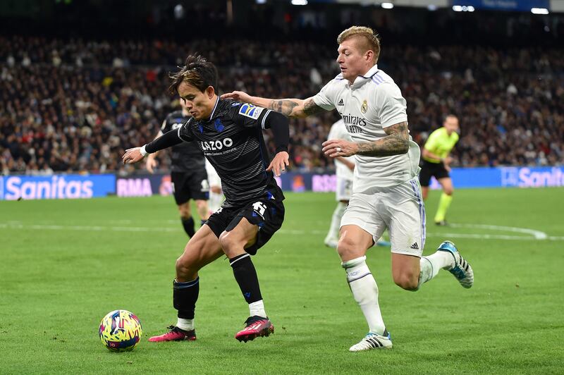 Takefusa Kubo is challenged by Real Madrid midfielder Toni Kroos. Getty