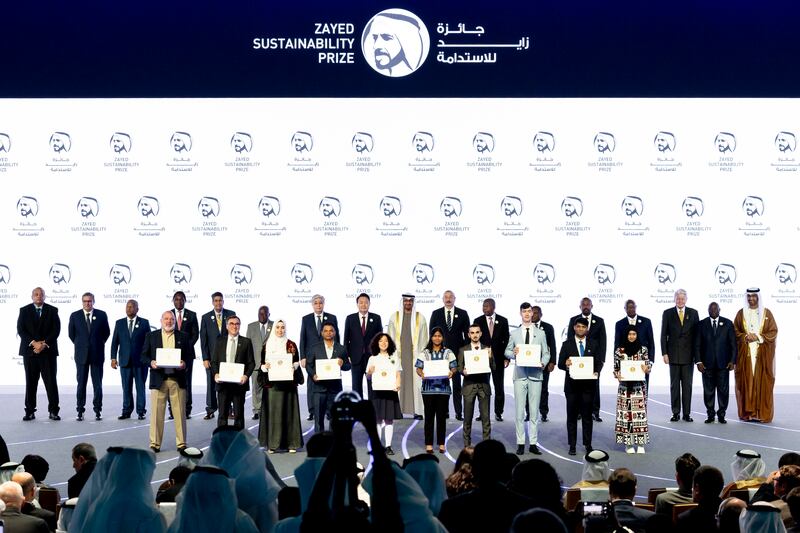 Back row, left to right: Siaosi Sovaleni, Prime Minister of Tonga, Aziz Akhannouch, Prime Minister of Morocco, Wavil Ramkalawan, President of Seychelles, Hakainde Hichilema, President of Zambia, Surangel Whipps, President of Palau,  Nana Akufo-Addo, President of Ghana, Kasim-Jomart Tokayev, President of Kazakhstan, Yoon Suk Yeol, President of South Korea, President Sheikh Mohamed, Ilham Aliyev, President of Azerbaijan, Joao Lourenco, President of Angola, Filipe Nyusi, President of Mozambique, Abiy Ahmed, Prime Minister of Ethiopia, Yoweri Museveni, President of Uganda, Olafur Ragnar Grimsson, former president of Iceland and chairman of Arctic Circle, Tiemoko Meyliet Kone, Vice President of Ivory Coast, and Dr Sultan Al Jaber, UAE Minister of Industry and Advanced Technology, pose for a photograph with 2023 Zayed Sustainability Prize winners during the opening ceremony of Abu Dhabi Sustainability Week. Photo: UAE Presidential Court