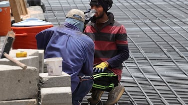 A construction worker takes a drink of water in Riyadh as temperatures soar. AFP