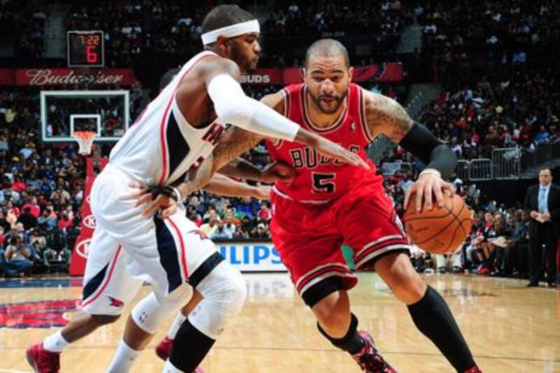 ATLANTA, GA - JANUARY 7: Carlos Boozer #5 of the Chicago Bulls drives during the game between the Chicago Bulls and the Atlanta Hawks on January 7, 2012 at Philips Arena in Atlanta, Georgia. NOTE TO USER: User expressly acknowledges and agrees that, by downloading and/or using this Photograph, user is consenting to the terms and conditions of the Getty Images License Agreement. Mandatory Copyright Notice: Copyright 2012 NBAE   Scott Cunningham/NBAE via Getty Images/AFP