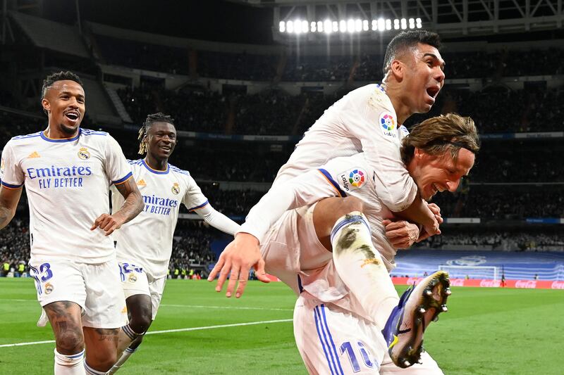 Luka Modric celebrates with teammates after scoring for Real Madrid against Real Sociedad. AFP