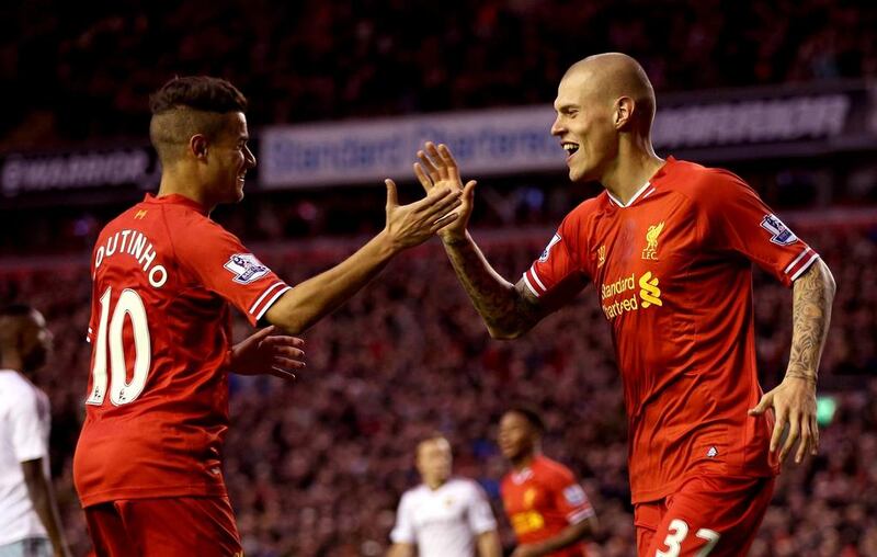 Martin Skrtel, right, of Liverpool celebrates the second goal with Coutinho during their team's victory over West Ham on Saturday night. Clive Brunskill / Getty Images